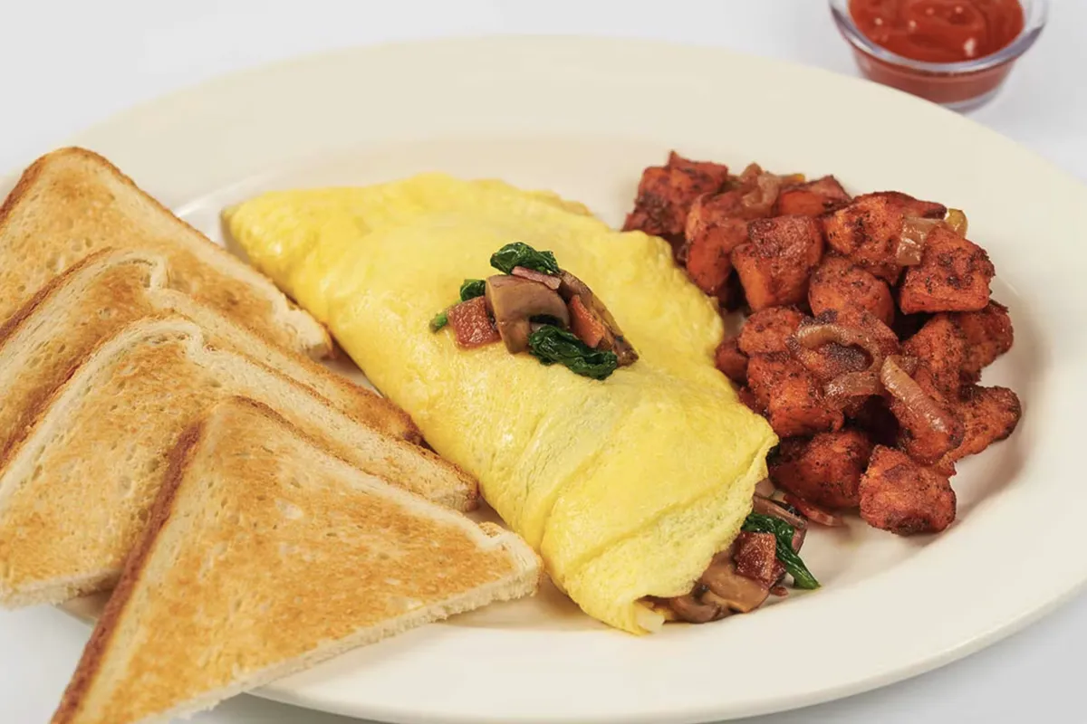 Spinach, mushroom, bacon and cheese omelette