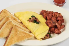 Spinach, mushroom, bacon and cheese omelette