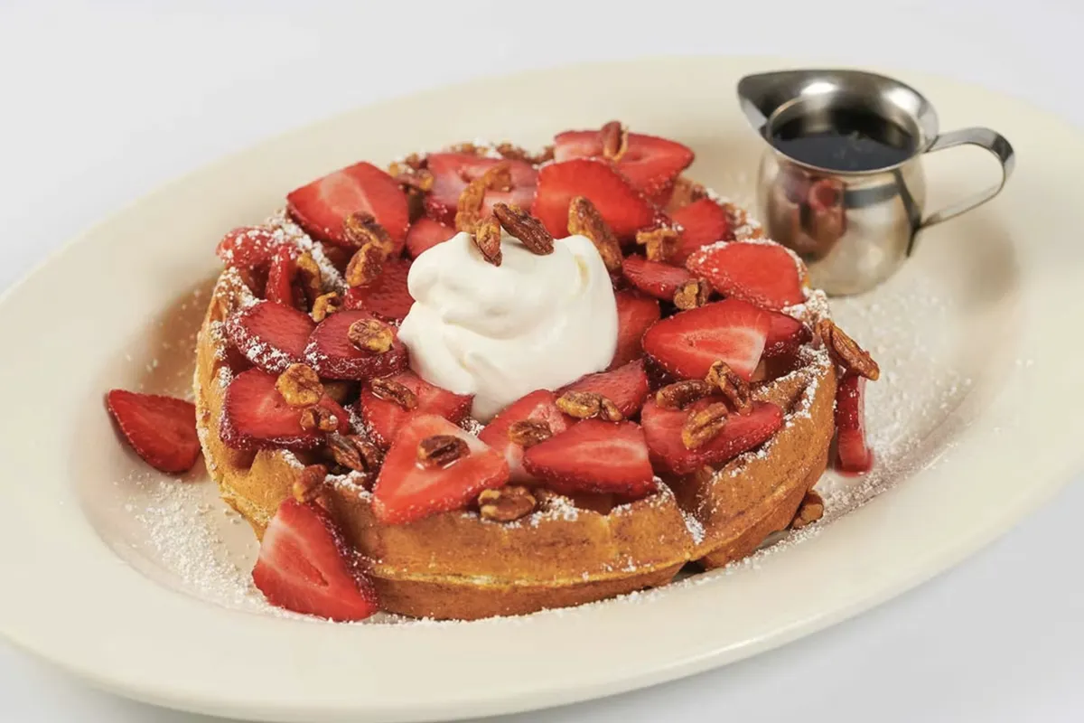 Giant Belgian waffle with strawberries, pecans and chantilly cream